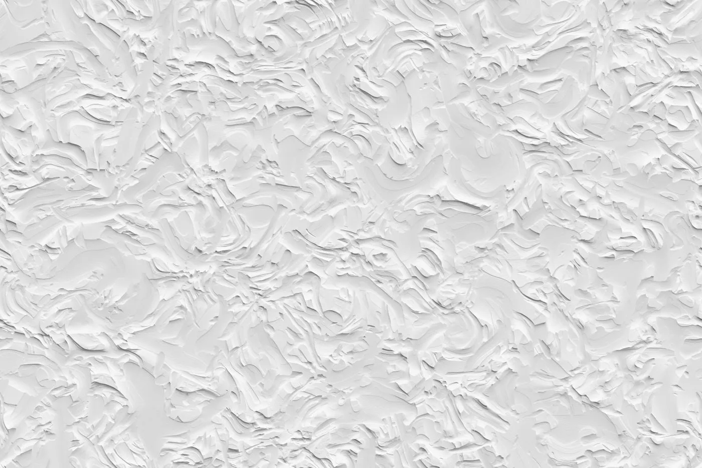 Detalle de una pared con estuco decorativo blanco en relieve